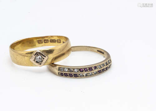 A 22ct gold diamond set wedding band, ring size Z, 4.9g and a 9ct gold ruby and eight cut diamond