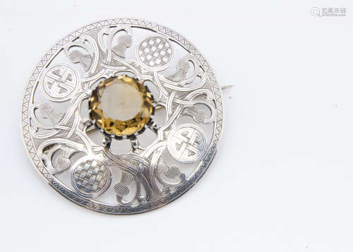 An Irish Celtic George V silver and citrine plaid brooch, dated Dublin 1912, makers JC & S, 7cm
