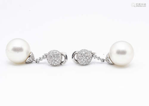 A pair of 18ct gold diamond and cultured pearl **** clip earrings, the large white pearls
