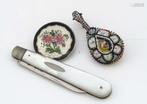 A continental silver and enamel floral circular brooch, 3cm diameter together with a silver and
