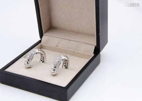 A pair of Bvlgari 18ct white gold and diamond encrusted clip earrings, of hoop design with a chevron