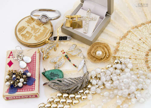 A collection of costume jewellery, including necklaces, gilt metal bracelets, brooches, compacts and