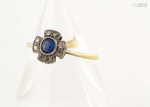 A sapphire and diamond Art Deco ring, the cruciform platinum setting centred with oval sapphire