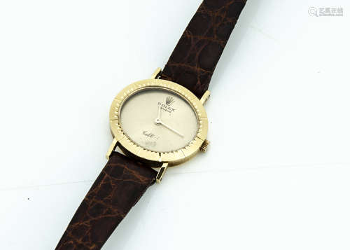 A c1980s Rolex Cellini 18ct gold cased lady's wristwatch, oval shaped case 26mm wide, gilt dial,