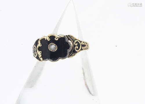 A 19th Century gold and enamel pearl set mourning ring, of shaped central panel with enamel and gold