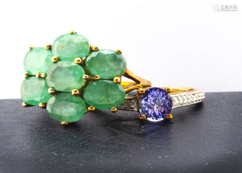 Two contemporary gem set gold rings, comprising a tanzanite and diamond dress ring, the circular