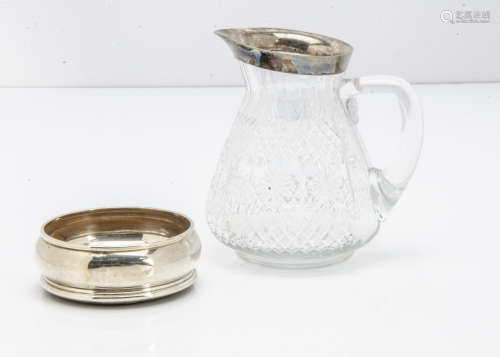 A modern silver bottle coaster by WEV, dent to side, together with a nice cut glass and silver
