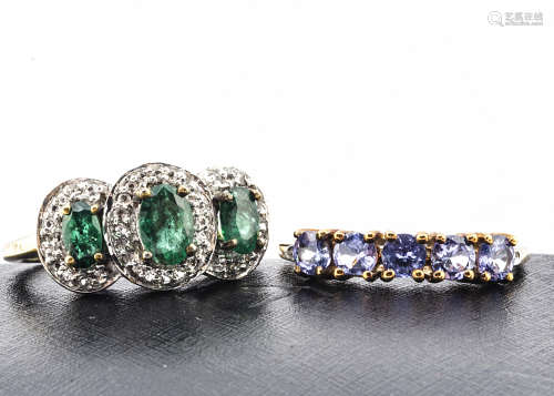 Two contemporary gem set rings, including a silver gilt emerald and white topaz triple cluster, ring