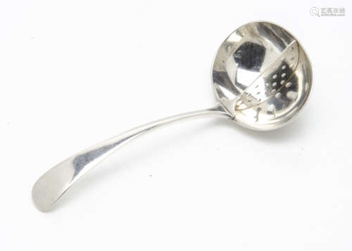 A George V silver straining spoon, 1.4ozt, Old English pattern with grill inset to bowl