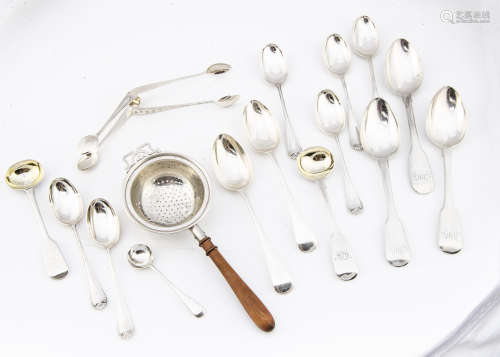 A group of silver spoons and ****, including a silver tea strainer with wooden handle by Adie