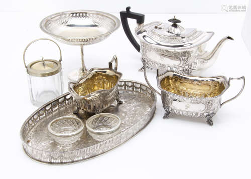 A late Victorian three piece silver plated tea set, together with a pair of cut glass salts with