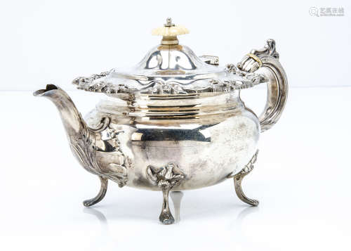 A late Victorian silver bachelors teapot by J & T, floral design to upper rim and on four