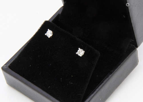 A pair of 18ct gold diamond set ear studs, total diamond weight 0.40ct