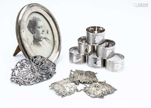 A late Victorian silver nurses buckle from Elkington & Co, together with a set of six silver
