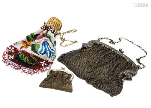 Three late 19th Century purses, one silver with mythical fish and bearin***arks, possibly French,