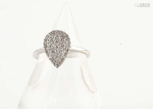 An 18ct gold diamond set pear shaped dress ring, the pave set diamonds in a white gold setting and