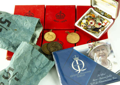 A collection of coins and medallions and other ****s, including four George V silver jubilee