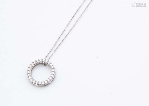 An 18ct white gold diamond set circular pendant, the brilliant cuts in claw settin***arked 750 on