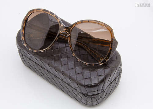 A cased pair of Bottega Veneta lady's sunglasses, the brown frames with gilt butterfly decoration in