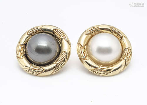 A pair of continental 18ct yellow gold mabe pearl set ear clips, in cream and black, surrounded in a