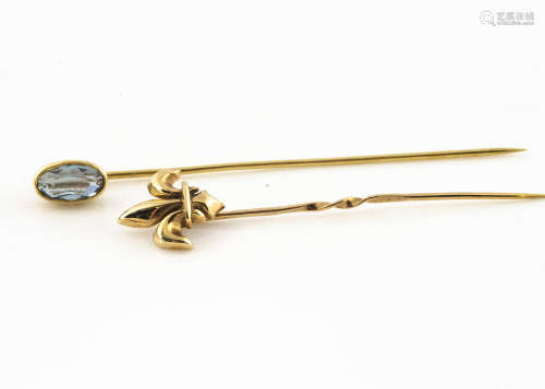 An 18ct gold aquamarine stick pin, the oval mixed cut in collet setting, 1.6g together with a 9ct