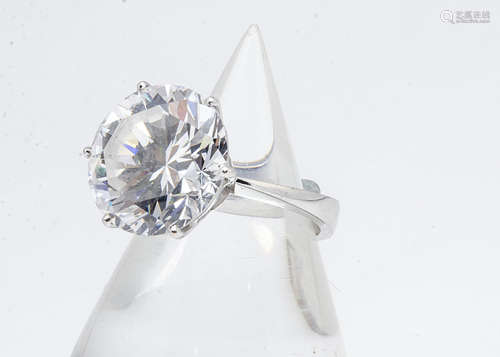 An 18ct gold synthetic moissanite dress ring, brilliant cut and claw set, ring size O, 10g