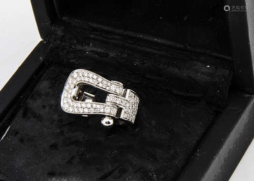 An 18ct gold Fred of Paris buckle ring, diamond encrusted on a plain white gold shank marked Fred,