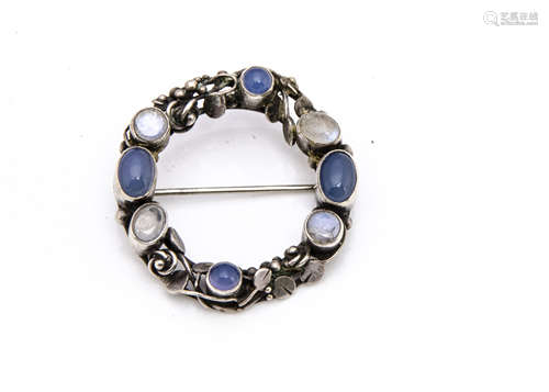 An Arts and Crafts silver moonstone and chalcedony wreath brooch, of circular form, attributed to