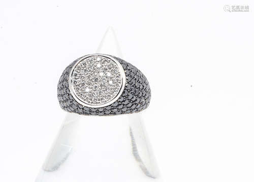 A continental 18ct white gold diamond signet ring, in white and black diamonds, ring size J, 6.3g