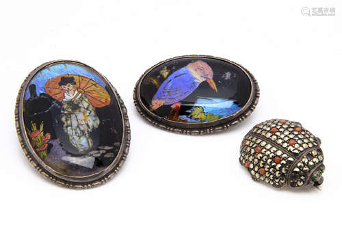 Three Art Deco silver brooches, including a ladybird marcasite and glass example, 2.5cm x 2cm and