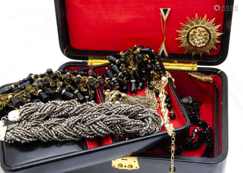 A collection of costume jewellery, including a black glass and gilt metal fringe work necklace,