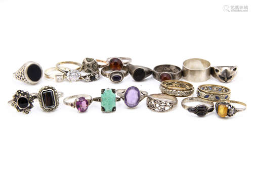 A collection of silver and gem set dress rings, including onyx, amber, cornelian and paste (21)