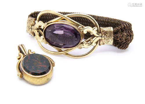 A Victorian amethyst, pinchbeck and human hair bracelet, the large oval amethyst in collared setting