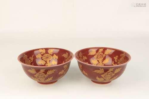 A Pair Of Red Glazed Gold-Decorated Porcelain Bowls