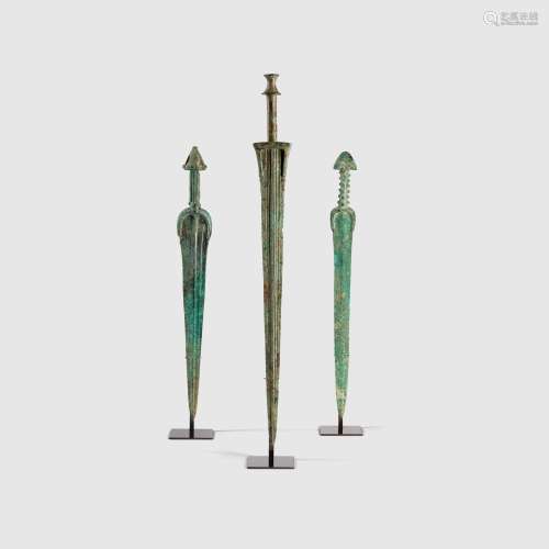 TRIO OF NEAR EASTERN SWORDS NEAR EAST, EARLY FIRST MILLENIUM B.C.