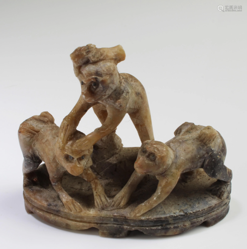 A Carved Soapstone Three Monkey Figurine