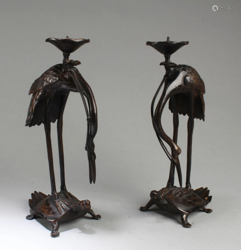 A Pair of Bronze Candle Holders