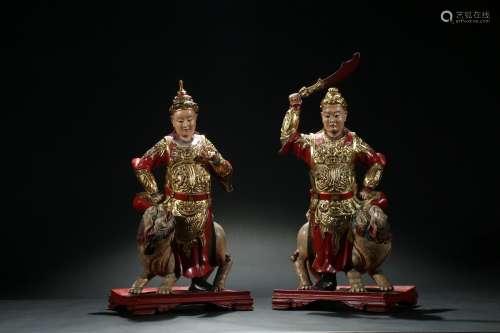 A PAIR OF LACQUERED RED AND GILT CELESTIAL WARRIORS