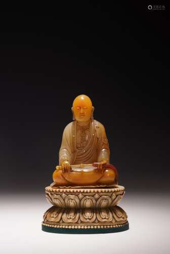 A SHOUSHAN SOAPSTONE CARVED LUOHAN ON STAND