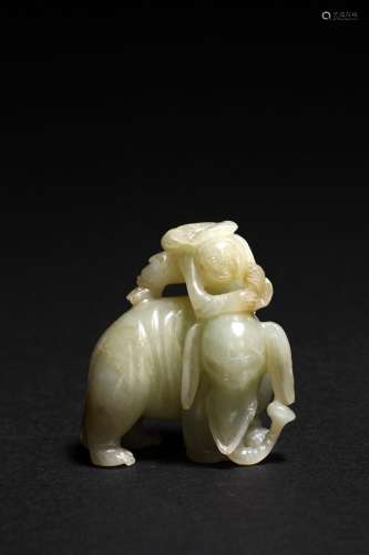 A CELADON JADE CARVING OF ELEPHANT AND BOY