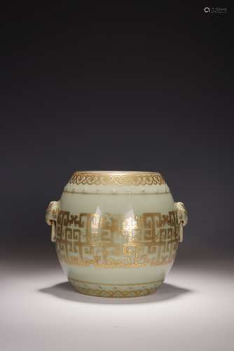 A CHINESE CELADON AND GILT DRUM SHAPED JAR