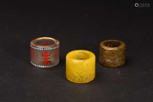 A SET OF THREE ARCHER'S RINGS