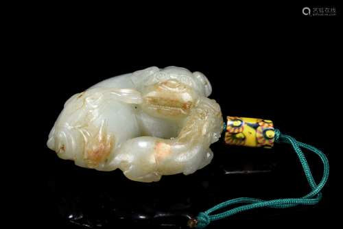 A WHITE JADE CARVING OF MYTHICAL BEAST