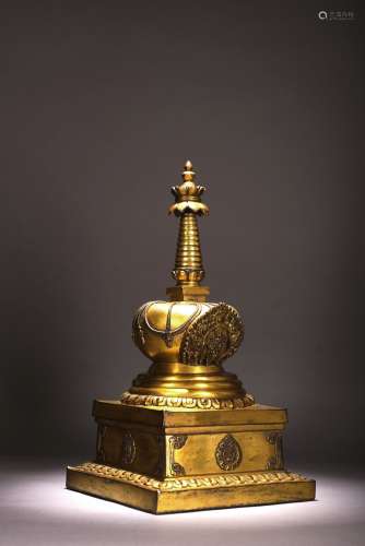 A TIBETAN GILT BRONZE CAST MODEL OF STUPA