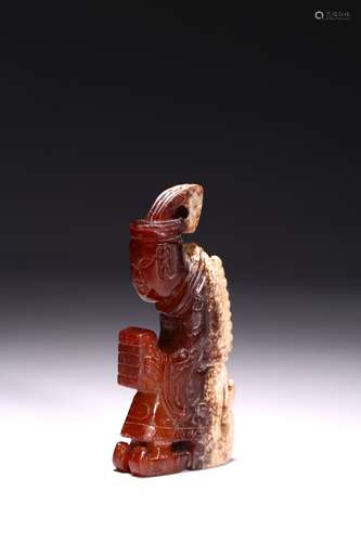 A JADE CARVED KNEELING FIGURE