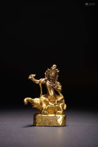 A GILT BRONZE FIGURE OF BUDDHIST GUARDIAN ON ELEPHANT