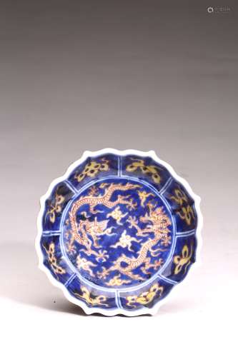 A BLUE GROUND YELLOW GLAZED 'DRAGON' DISH