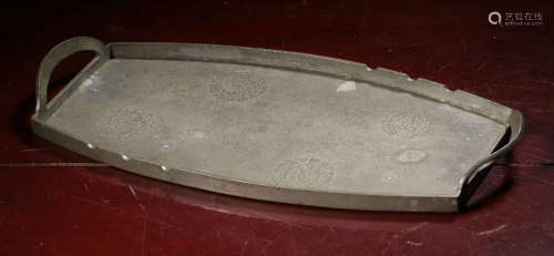 A TIN PLATE CARVED WITH FLOWER PATTERN