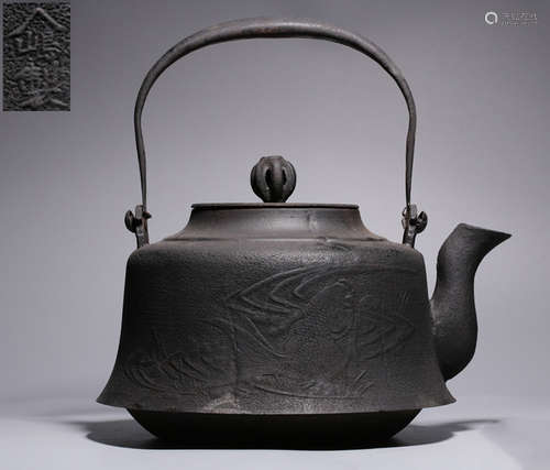 AN IRON POT CARVED WITH FISH PATTERN