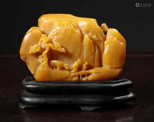 A TIANHUANG STONE PENDANT CARVED WITH LANDSCAPE